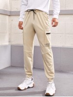 Men Drawstring Waist Letter Graphic Pocket Joggers