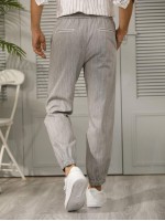 Men Drawstring Waist Slant Pocket Carrot Pants