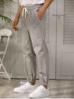 Men Drawstring Waist Slant Pocket Carrot Pants