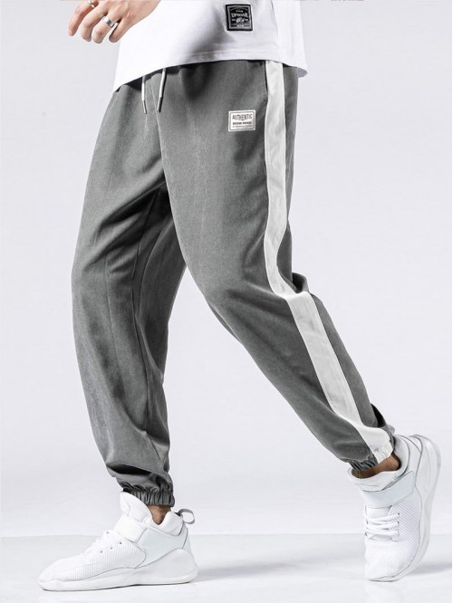 Men Contrast Panel Letter Graphic Drawstring Pants