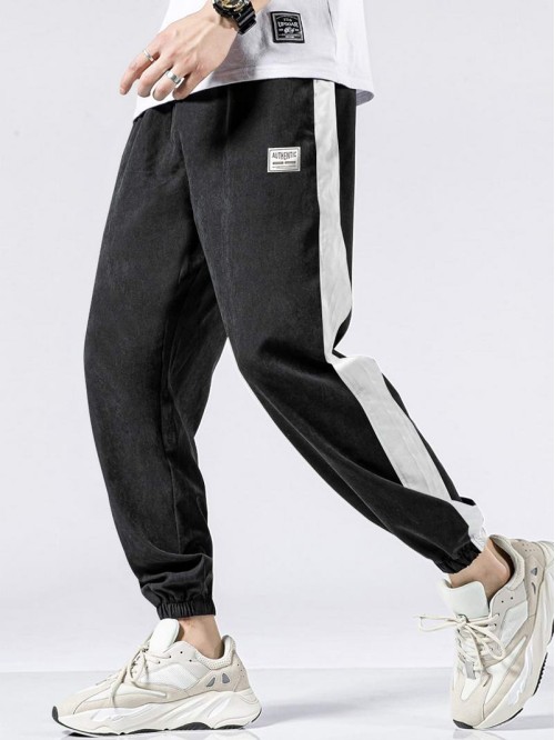 Men Contrast Panel Letter Graphic Drawstring Trousers