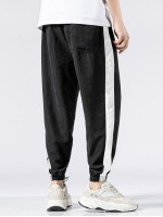 Men Contrast Panel Letter Graphic Drawstring Trousers